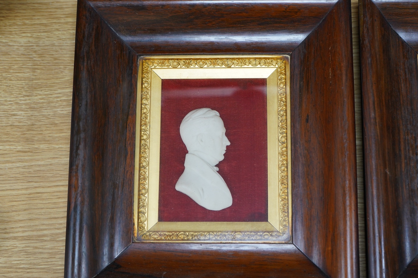 A pair of Victorian rosewood framed wax portraits of Dr. John Dick, 9cm wide, 12cm high. Condition - good